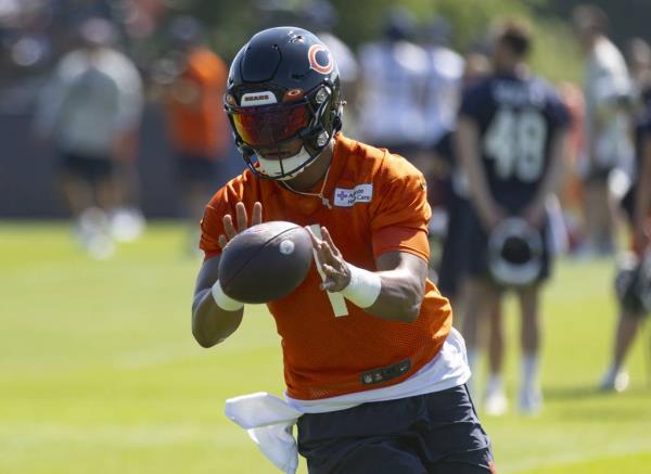 Bears quarterback Justin Fields practices during training camp Thursday at Halas Hall.